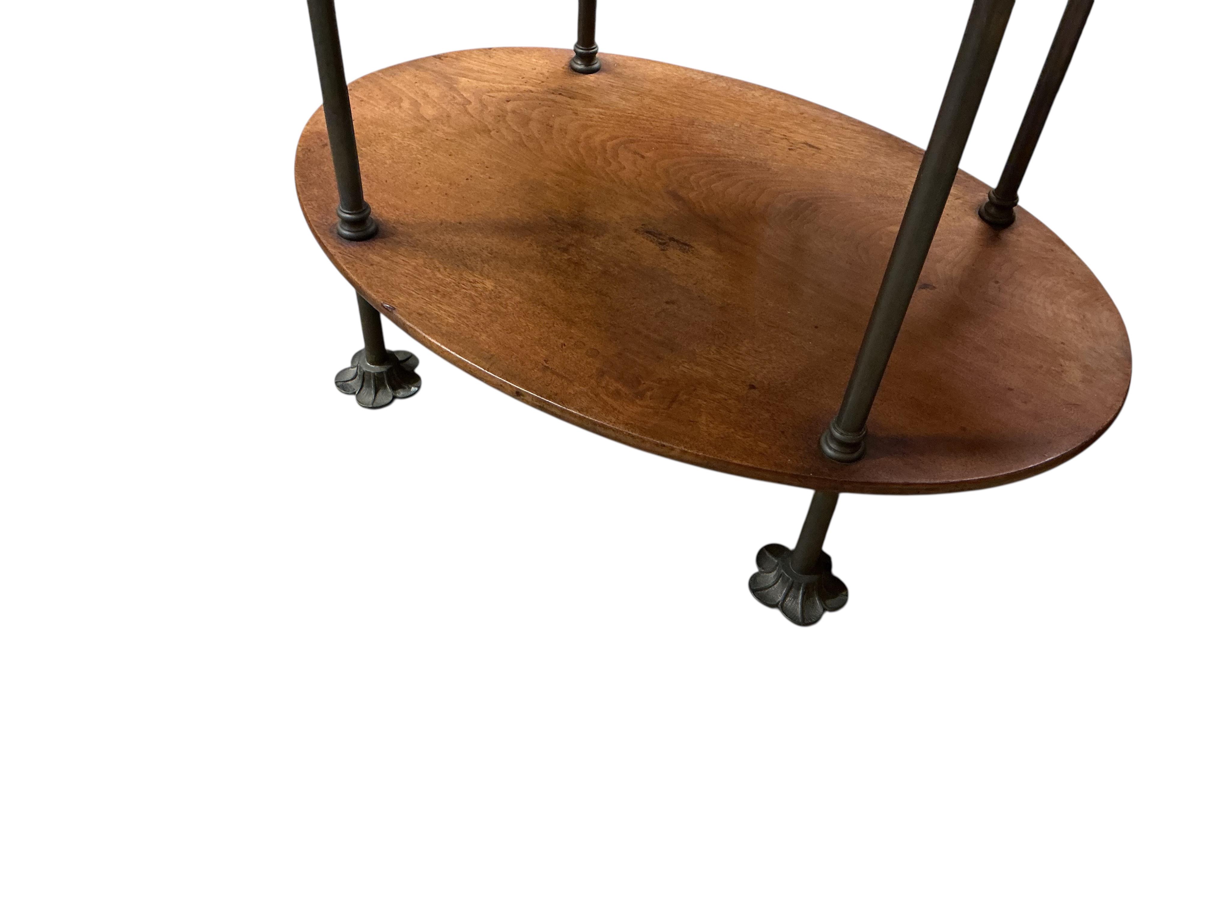 A 19th century oval mahogany and brass three tier campaign ship's wash stand, width 74cm, depth 49cm, height 84cm